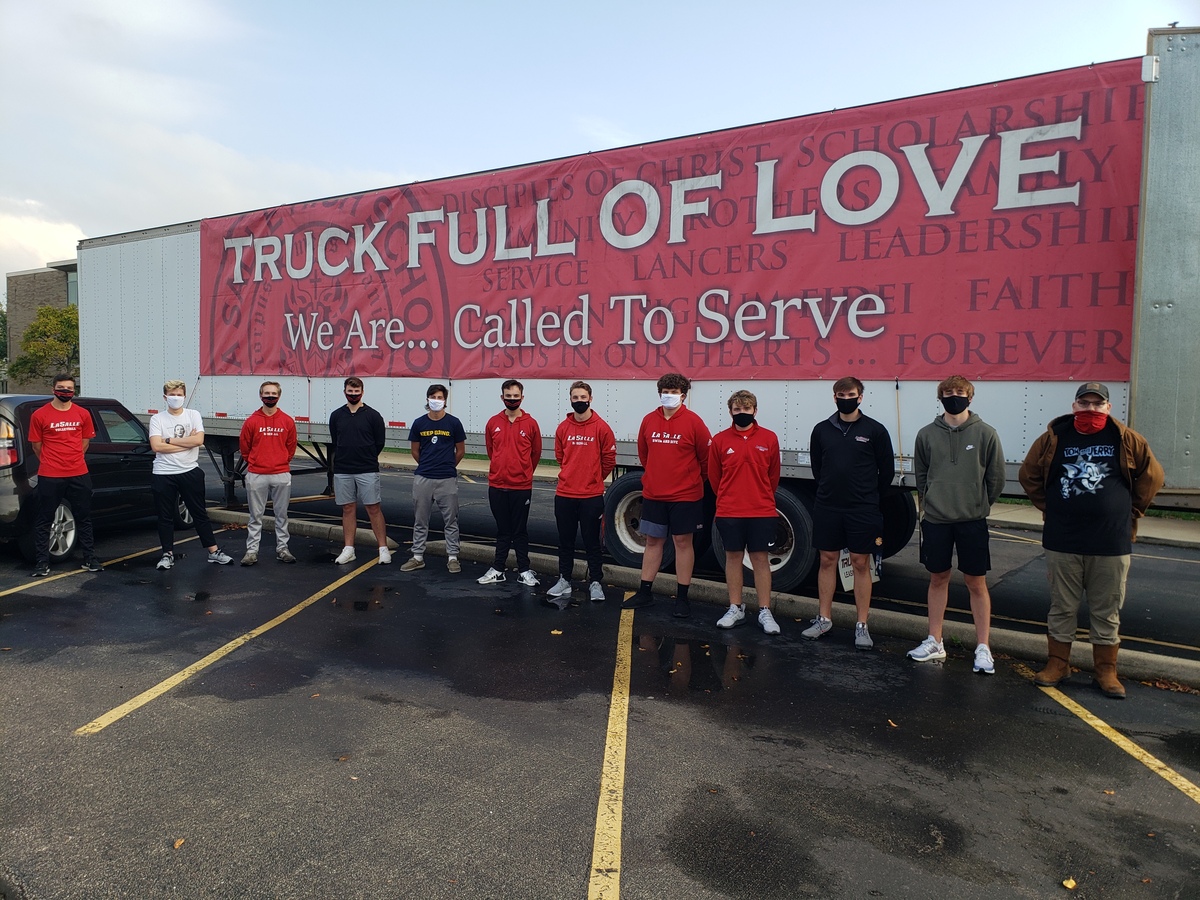 students in front of semi truck